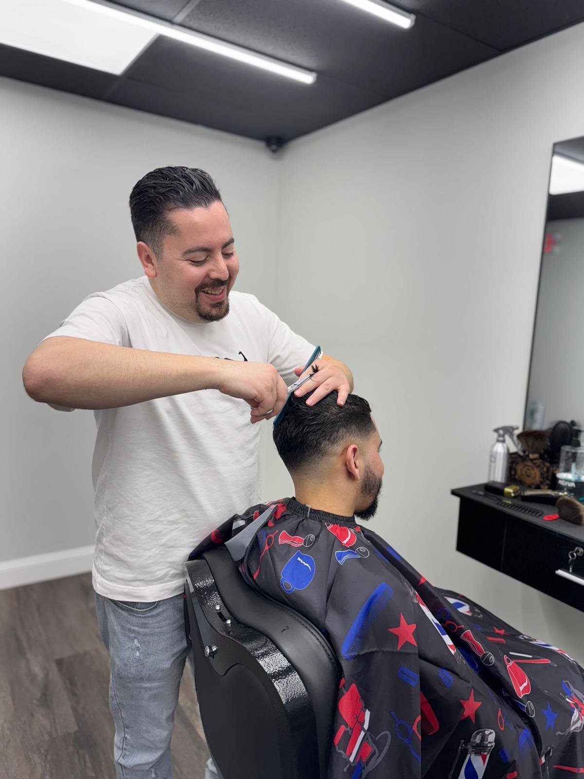 Expert barber providing a precision haircut at Belvedere Barbershop in Cambridge